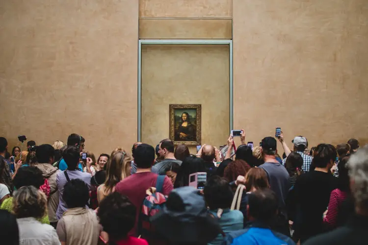 The Mona Lisa, one of the things to avoid in Paris if you dislike crowds
